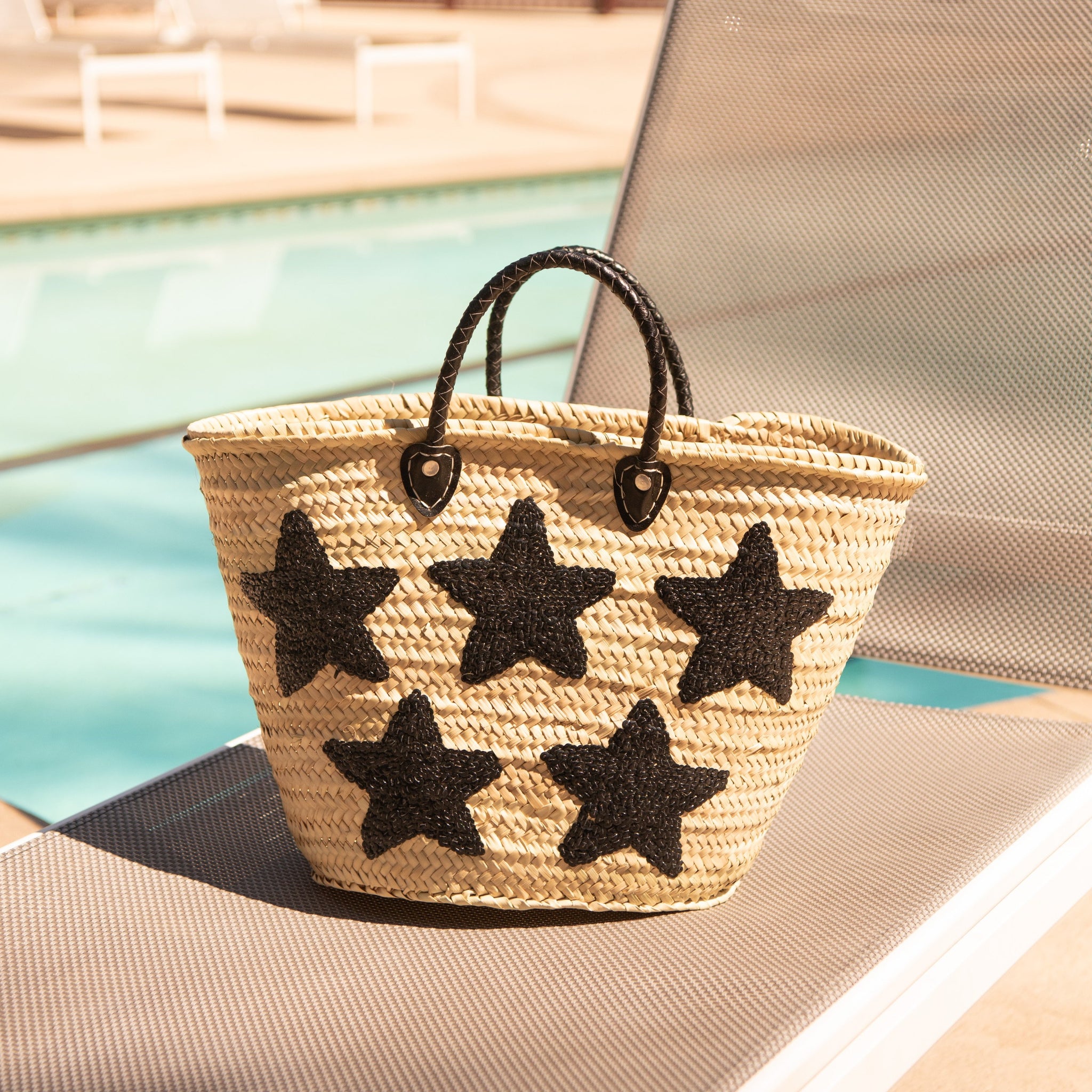 Large Straw Bag with Black Sequin Stars by the pool